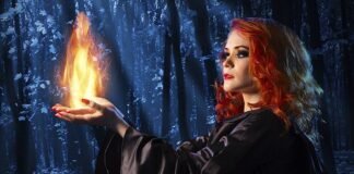 MI Witch witches magic woods fire red hair halloween iStock