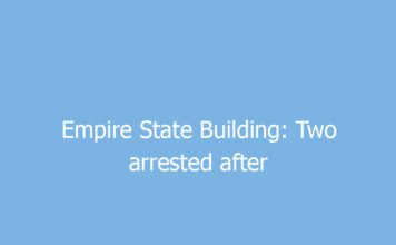 empire state building two arrested after unfurling love banner on antenna 9691 5e0ca